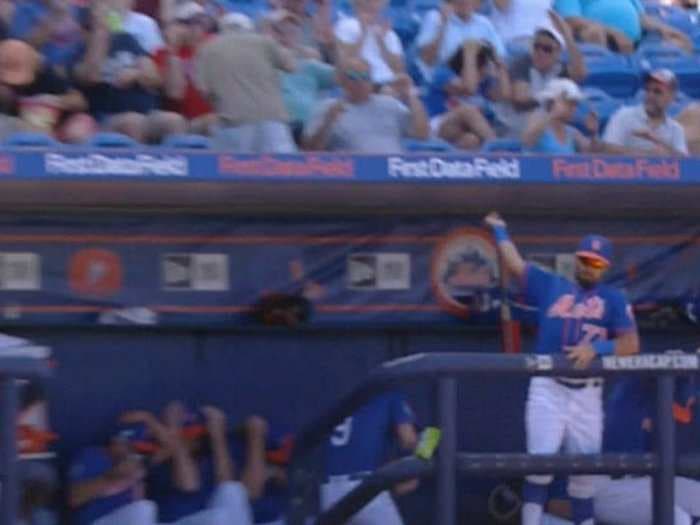 Mets minor leaguer makes ninja-like catch from dugout as bat comes flying toward him and teammates flee in terror