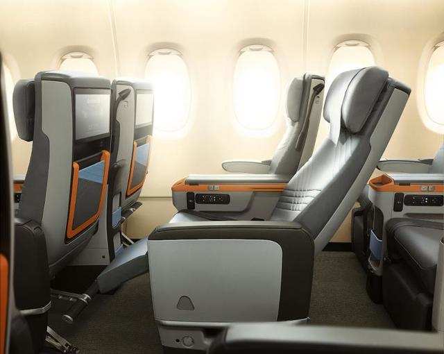 Premium economy passengers get 19.5-inch wide seats and 38 inches of seat pitch. In addition, the seats are equipped with a 13.3 inch HD screen and noise canceling headphones.