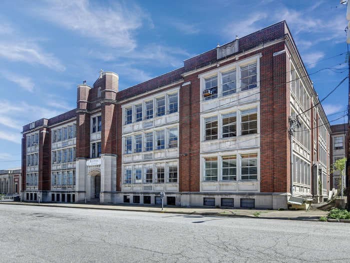 These 3 investors bought an abandoned high school for $100,000 and turned it into 31 luxury apartments. Take a look around.
