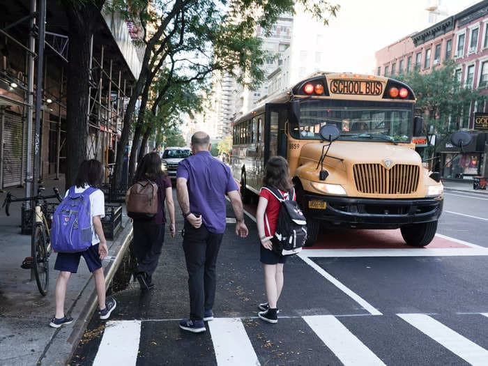 Kids' clothes and backpacks should never be loose when boarding a school bus — and 4 other safety tips parents should know from a transportation expert