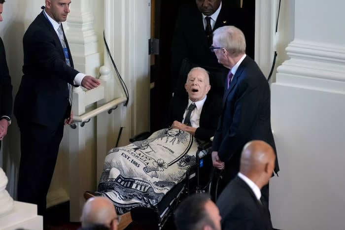 President Jimmy Carter wore a blanket with his late wife Rosalynn Carter on it to her memorial service