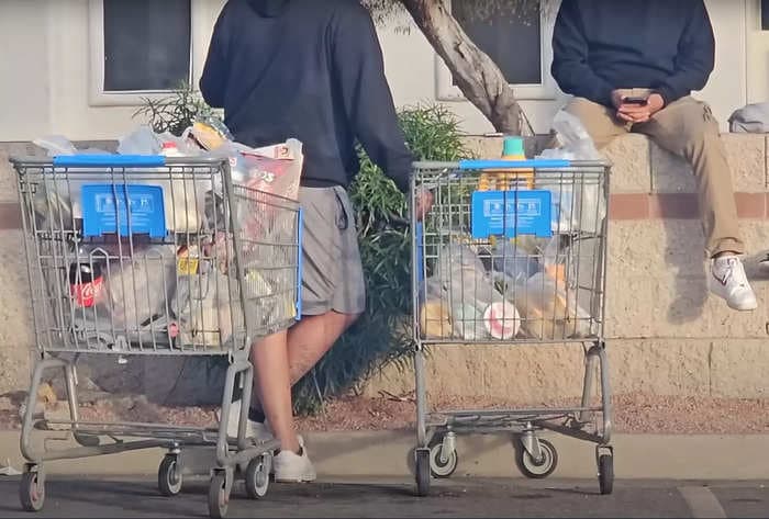A viral video appears to show Walmart Spark shoppers with perishable groceries waiting for a ride in the Arizona sun