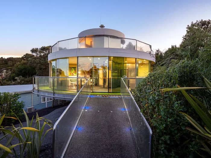 Take a tour of this futuristic spinning glass house that just hit the market in New Zealand for $665,000 