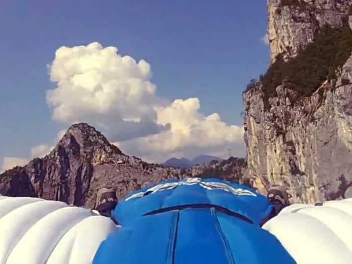 Real Or Fake? A Guy In A Wingsuit Jumps Off A Mountain And Lands On Water Without A Parachute