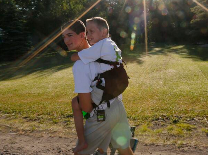 14-Year-Old Carries His Little Brother On His Back For 40 Miles To Raise Awareness For Cerebral Palsy