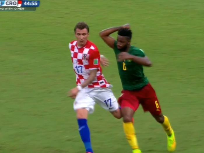 Cameroon Player Elbows Opponent In The Back For No Reason, Gets A Red Card