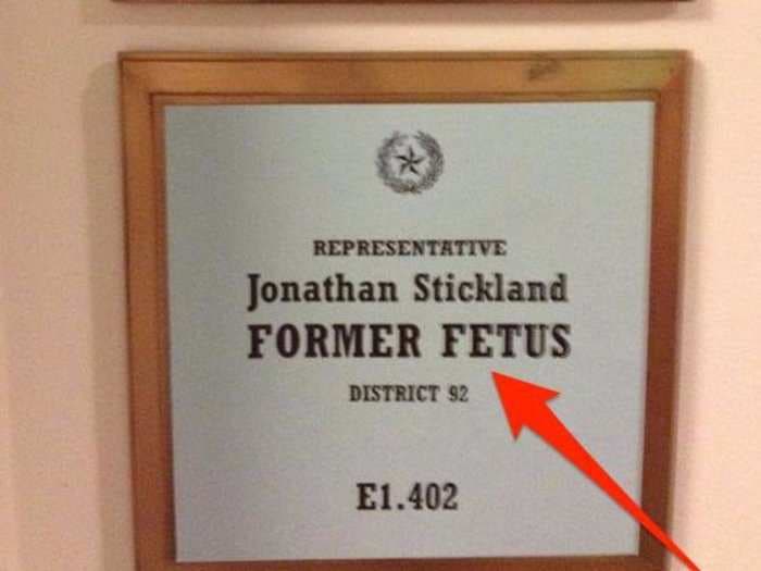 Texas lawmaker identifies himself as a 'former fetus' on a sign outside his office 