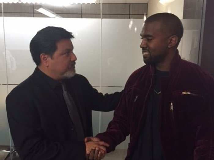 Here's an awkward photo of Kanye West shaking hands with the guy he allegedly attacked