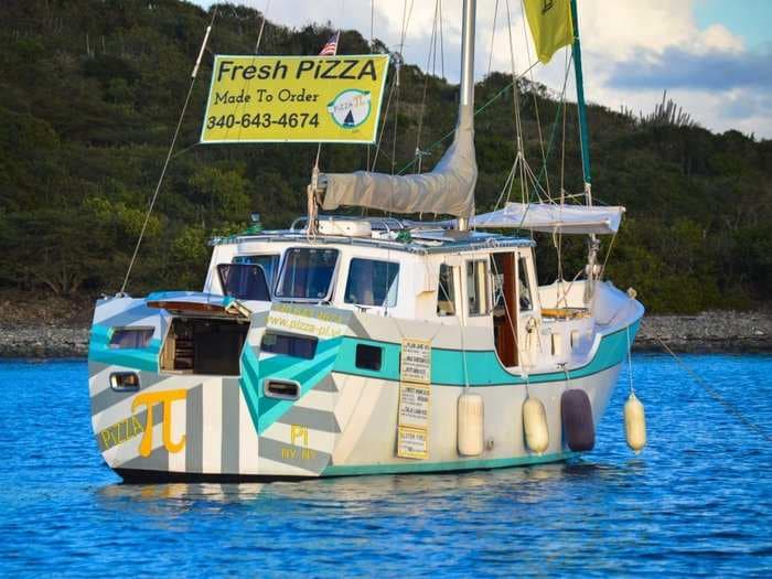 A couple quit their jobs to open a floating pizzeria in the Caribbean - and their business is thriving
