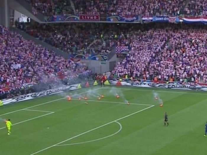 Croatian fans threw flares on the field during Euro 2016 match and one exploded within inches of a steward