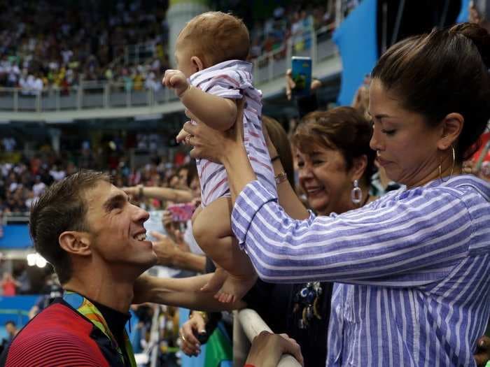 Michael Phelps wears shoes with his son's tiny footprint inside