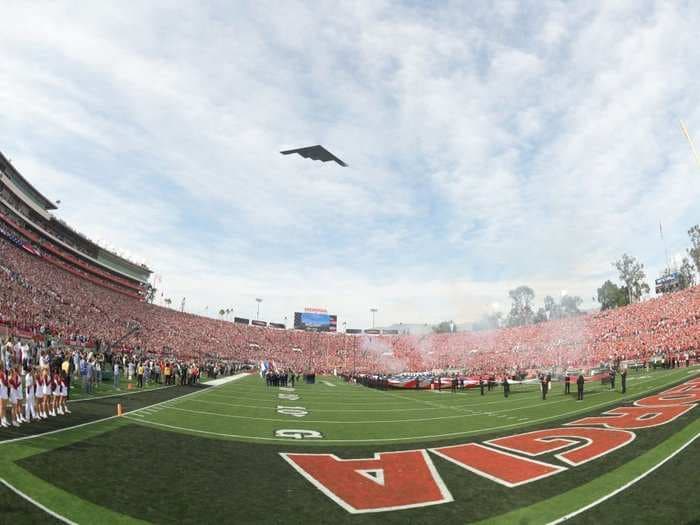 An aerial photographer took an incredible photo of a B-2 stealth bomber flying over the Rose Bowl