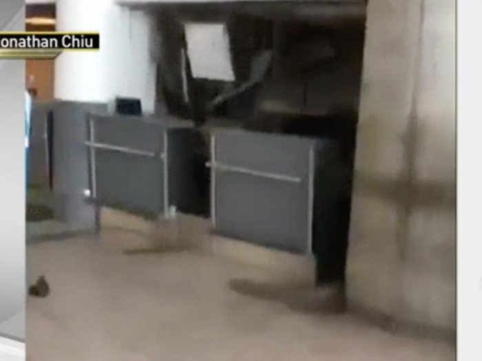 A JFK airport employee filmed a ceiling collapsing on his co-worker's desk after a pipe burst