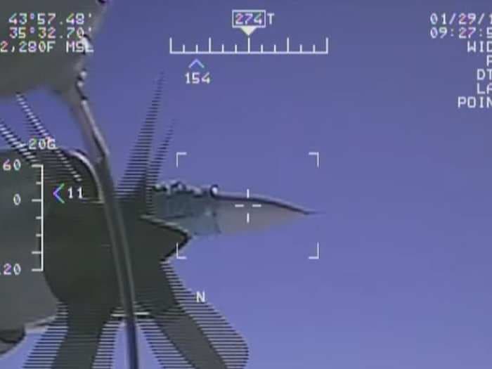 The US Navy released a ton more video of the Russian fighter jet that intercepted its spy plane from 5 feet away - and it shows just got close the Russian got