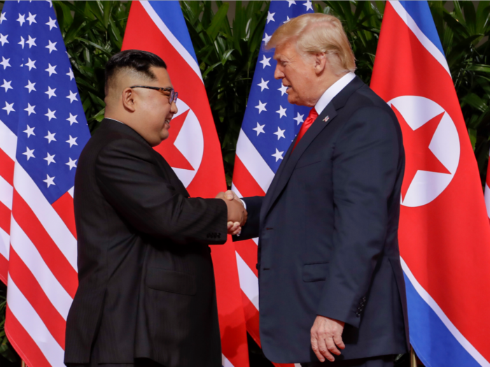 Watch the moment Trump and Kim Jong Un share a historic handshake at Singapore summit