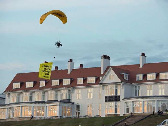 Scottish police are still looking for the protester who paraglided stunningly close Trump, then escaped