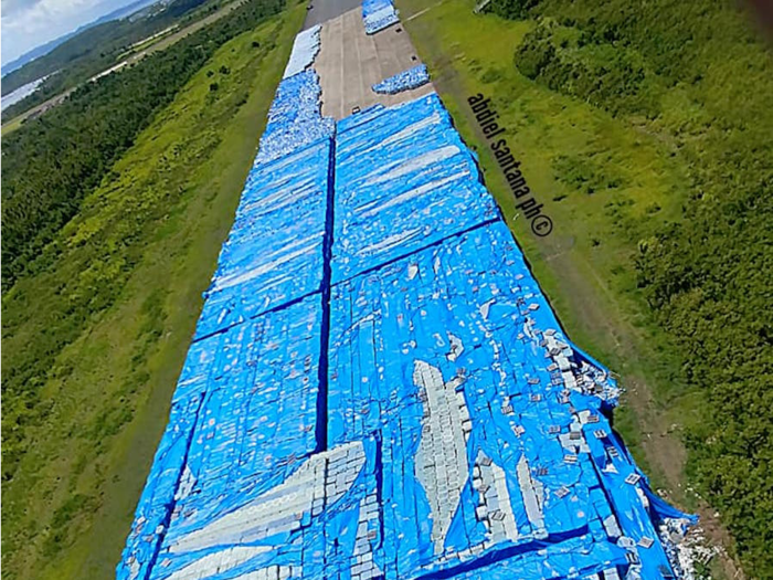 Photos reportedly show massive stockpile of bottled water left on a runway for more than a year in Puerto Rico after Hurricane Maria