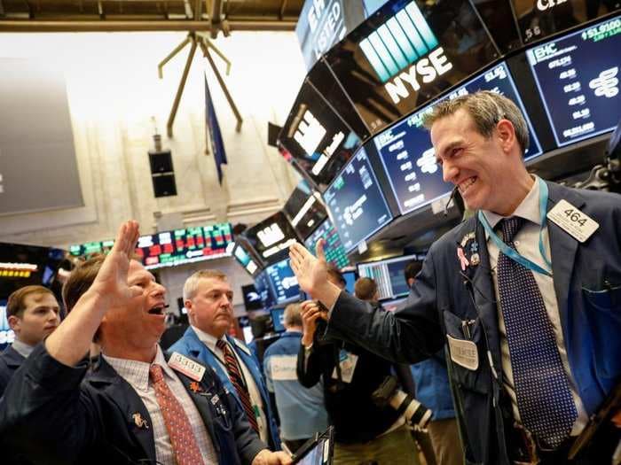 Stocks hit record highs after strong economic data