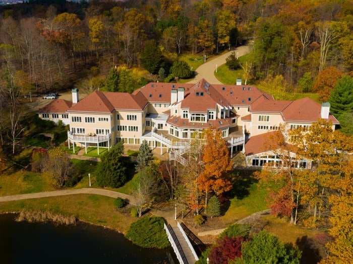 50 Cent was reportedly spending $70,000 a month on his 52-room Connecticut home. We asked 3 realtors to break down the 'invisible' costs of owning a mansion.
