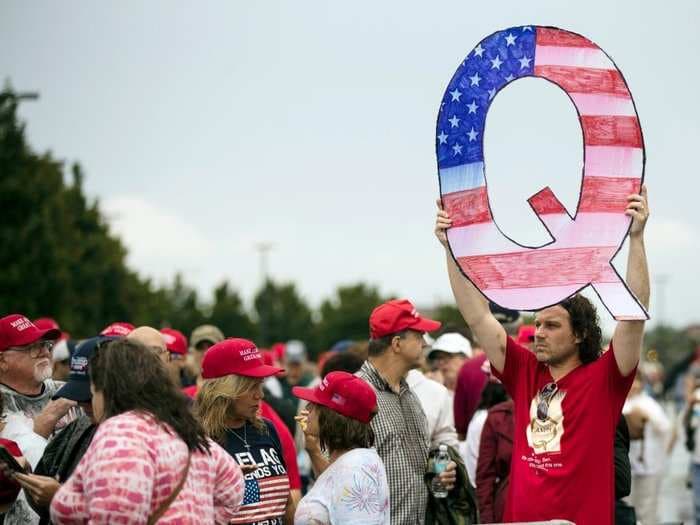A Trump campaign ad featured QAnon signs weeks after the FBI warned conspiracy theories are a domestic terrorism threat
