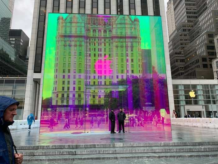 Apple's iconic glass cube outside its flagship 5th Avenue store has finally returned - check out its mesmerizing, colorful new look before it goes back to normal