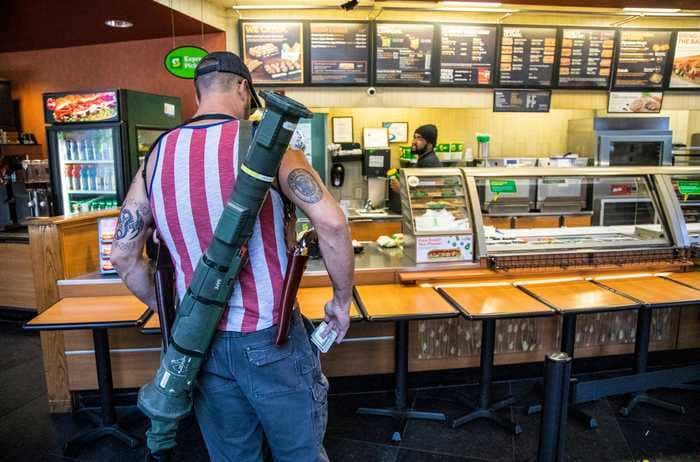 Photos of armed protesters in North Carolina carrying a rocket launcher, shotguns, and pistols while ordering food at a Subway restaurant go viral