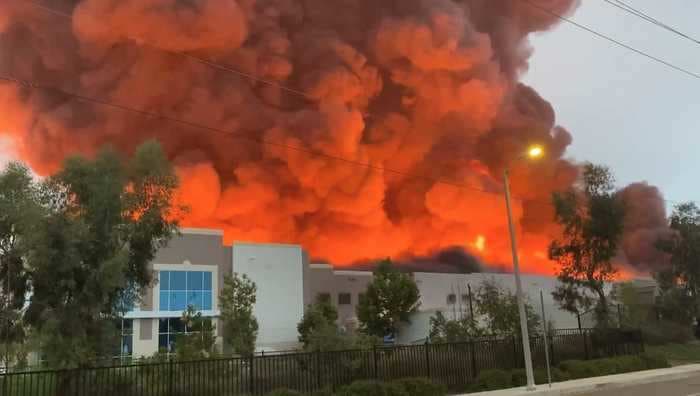 Amazon trucks burn as a massive fire tears through a California warehouse that delivers the company's extra-large shipments