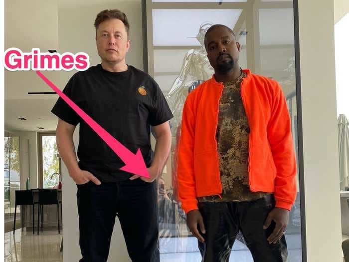 A reflection in a photo of Elon Musk and Kanye West appears to show Grimes taking the picture