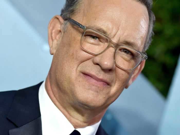 Tom Hanks said the 'cruel whipmasters at Apple' made him do an interview in front of a blank wall so people couldn't scrutinize things in his home