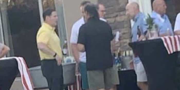 Photo shows Arizona's governor without a mask at party with no social distancing days before telling constituents to 'arm yourself with a mask'