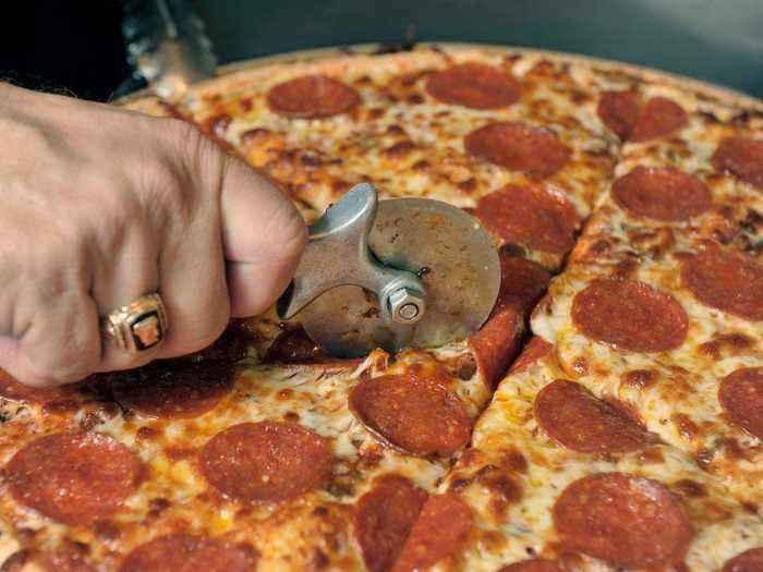 Pepperoni prices are skyrocketing as meat packing plants struggle to keep up with Americans' insatiable appetite for pizza