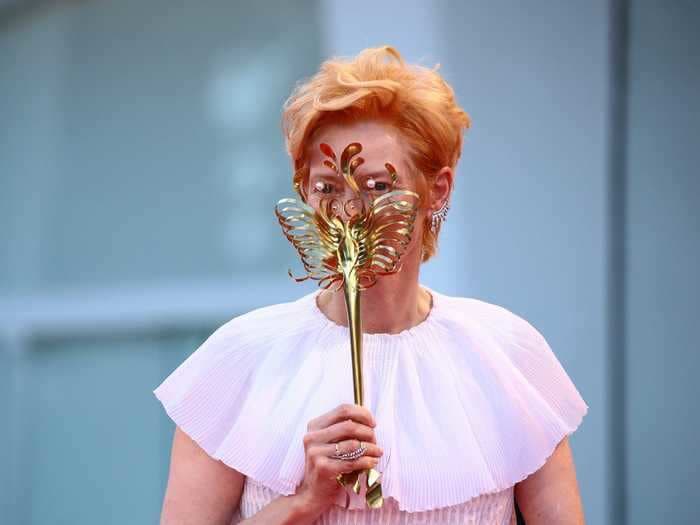 Tilda Swinton walked the Venice Film Festival red carpet carrying a custom face mask inspired by 'stingray skeletons'