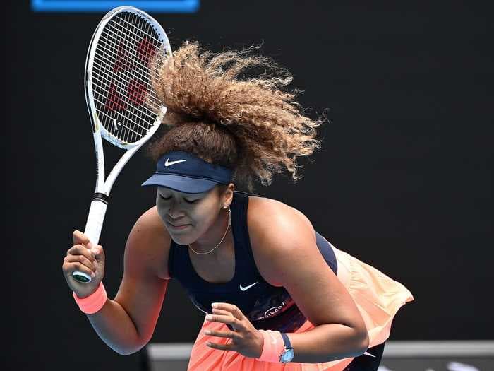 Naomi Osaka threw her racket in frustration before winning a 3-set Australian Open battle vs Garbiñe Muguruza
