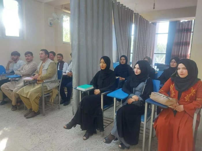 Photos show a curtain dividing women from men at a university in Afghanistan