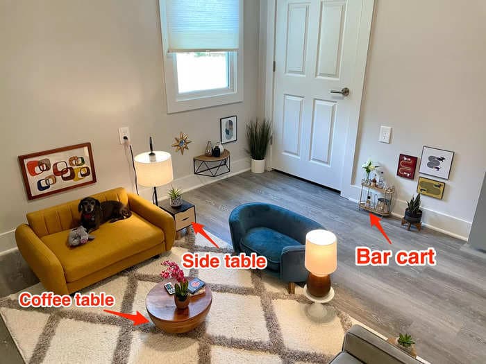 A TikToker created a mini living room for his dogs, complete with couches, a bar cart, and a TV