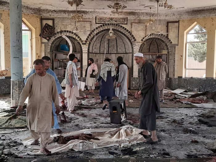 A bomb detonated at a packed mosque in northern Afghanistan and killed or wounded at least 100 people