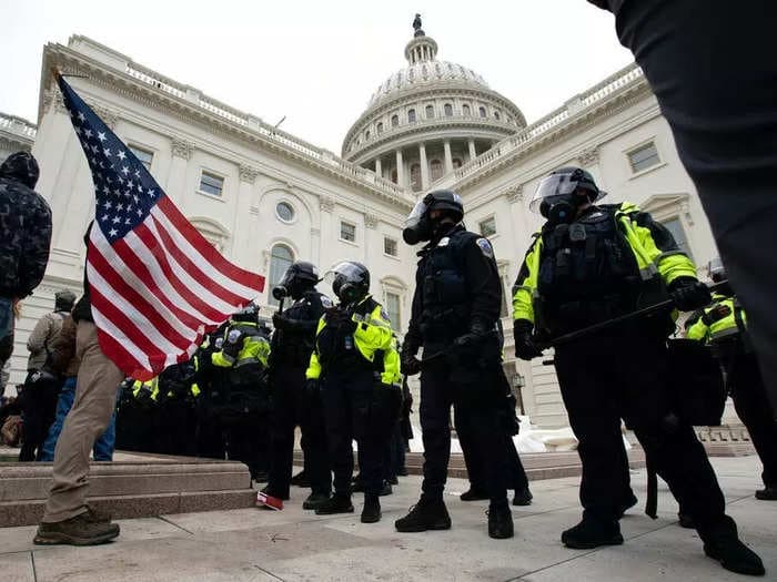 A man who was accused of discharging bear spray at law enforcement officers during the Capitol riot was arrested by the FBI after he enlisted in the Air Force