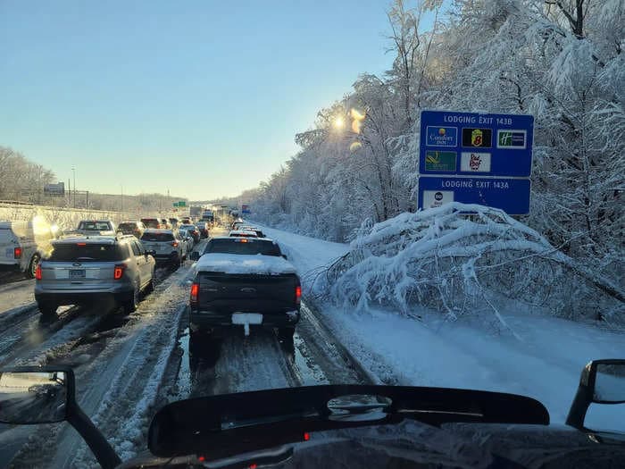 NBC reporter among hundreds stranded on icy Virginia highway says drivers are turning off their cars to conserve fuel and walking their dogs on the frigid road