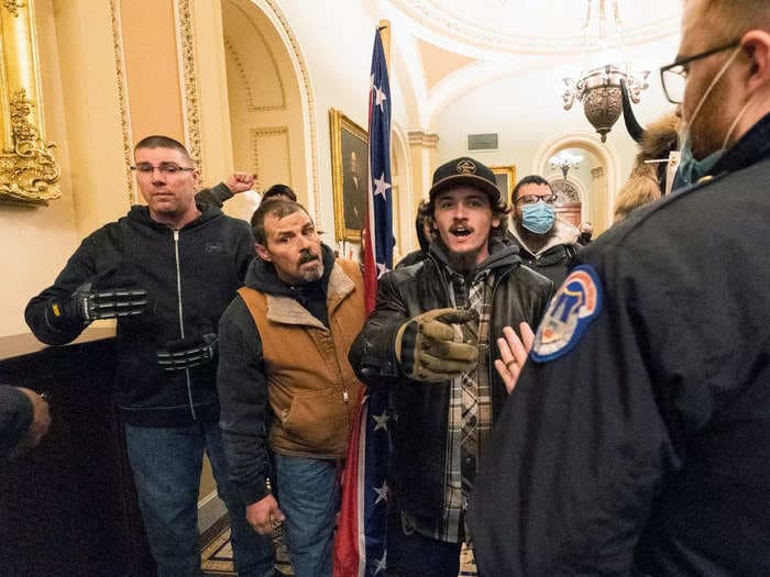 Man who carried a Confederate flag inside the US Capitol was the 'complete opposite of pleasant,' cop testifies