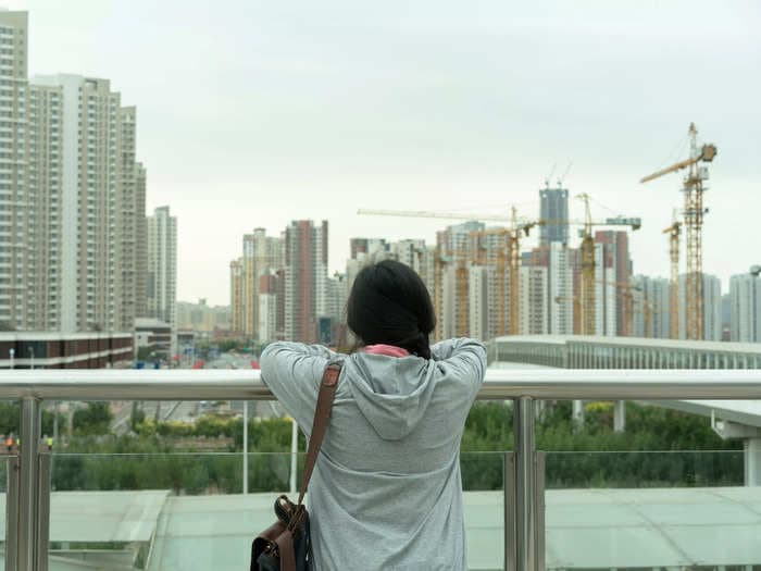 Homebuyers in China are refusing to keep paying mortgages for unfinished apartments, adding to the cash crunch in the sector that could spread globally