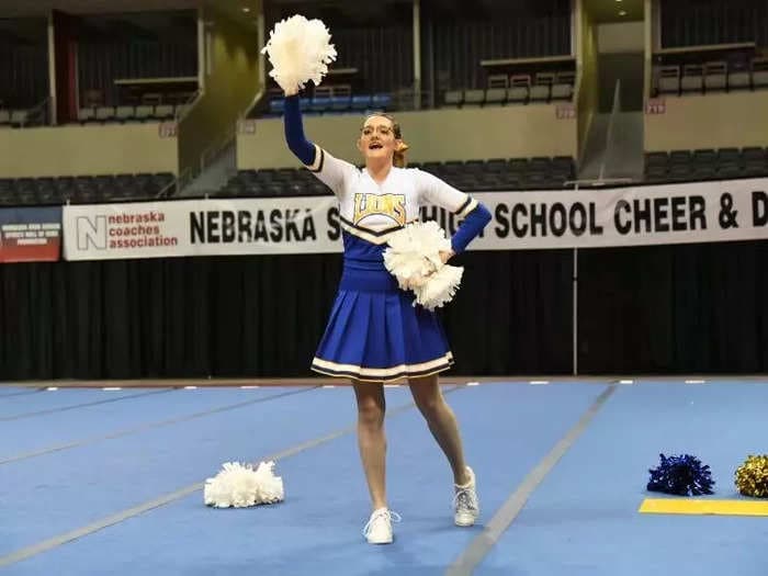 A Nebraska high-school cheerleader competed on her own after the rest of her squad quit. She said the support she got from other teams was 'overwhelming.'