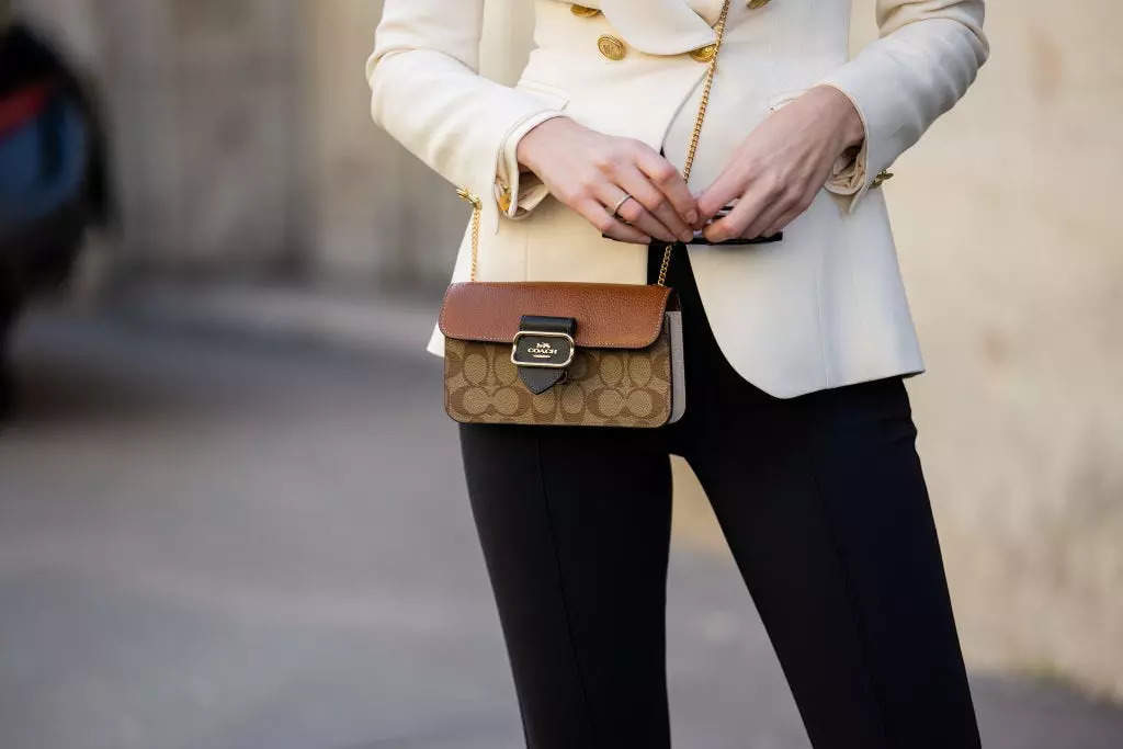 The handbag wars have begun after the US sued to block the merger of ...