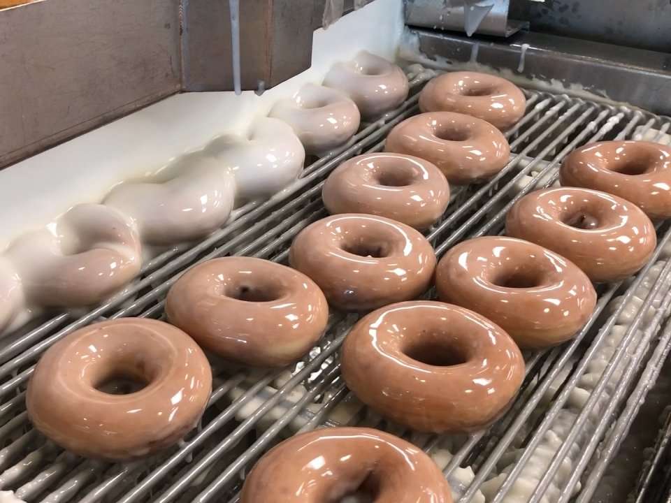 This mouthwatering video shows how a single Krispy Kreme store makes 50,000 donuts a day