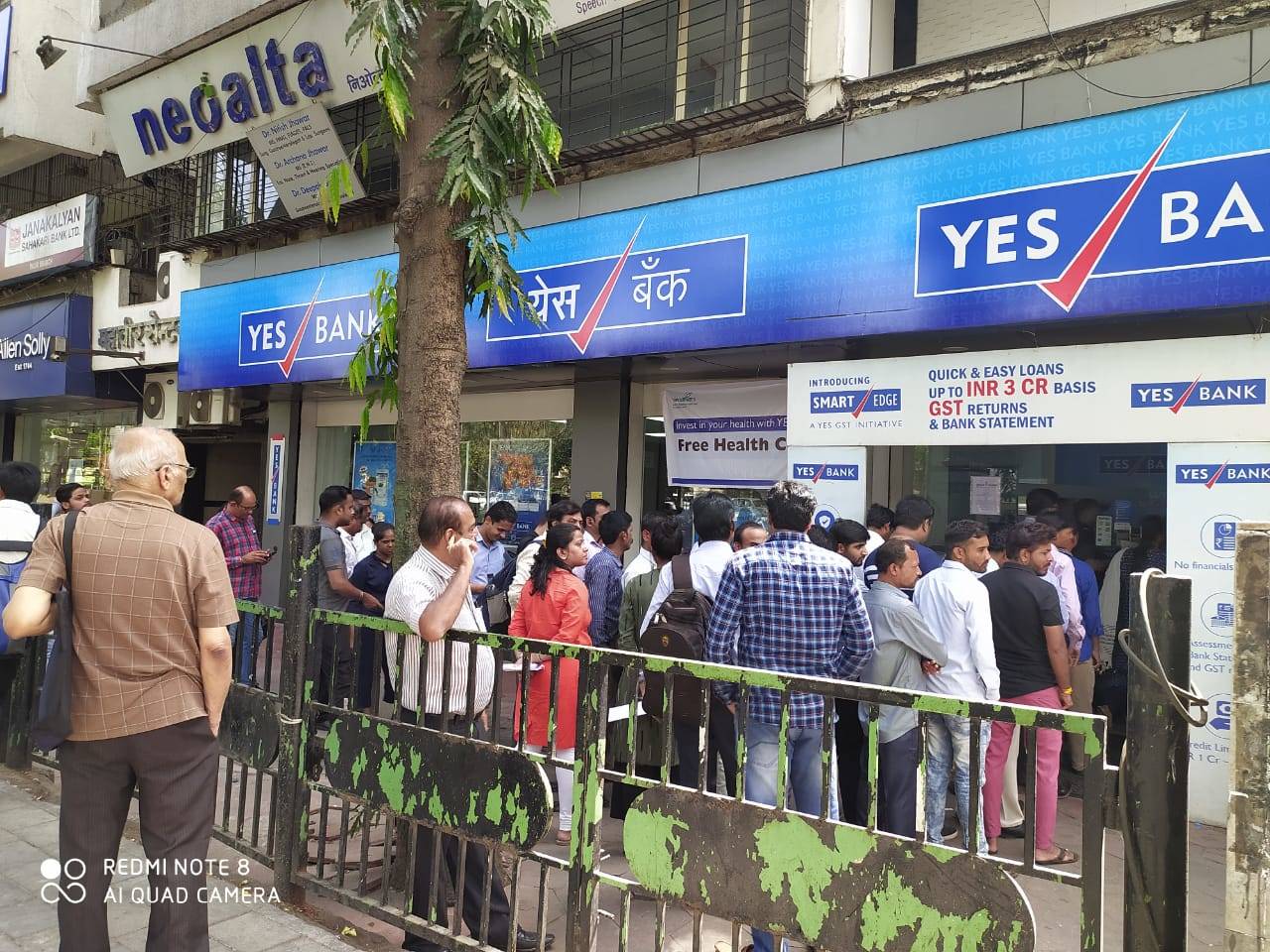 In pics: Customers of Yes Bank line up outside ATMs for cash fearing loss  of deposits