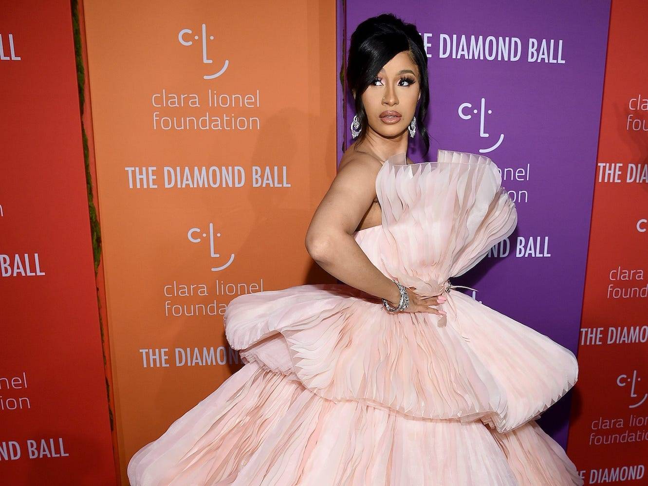 Cardi B wore a colorful dress made entirely out of bandanas with a matching Birkin  bag