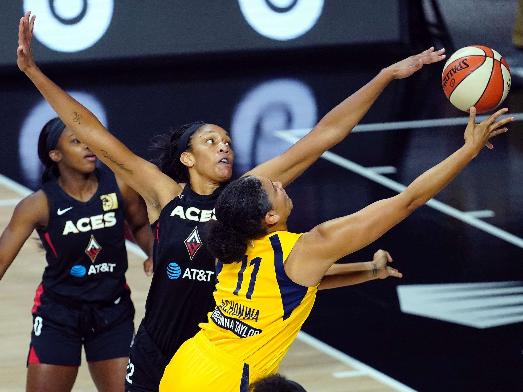 A'ja Wilson blocks a shot during a WNBA game with the Las Vegas Aces.A...