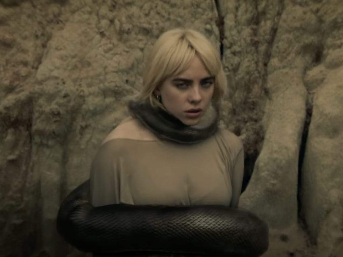 Billie Eilish gets constricted by a snake in the haunting ...