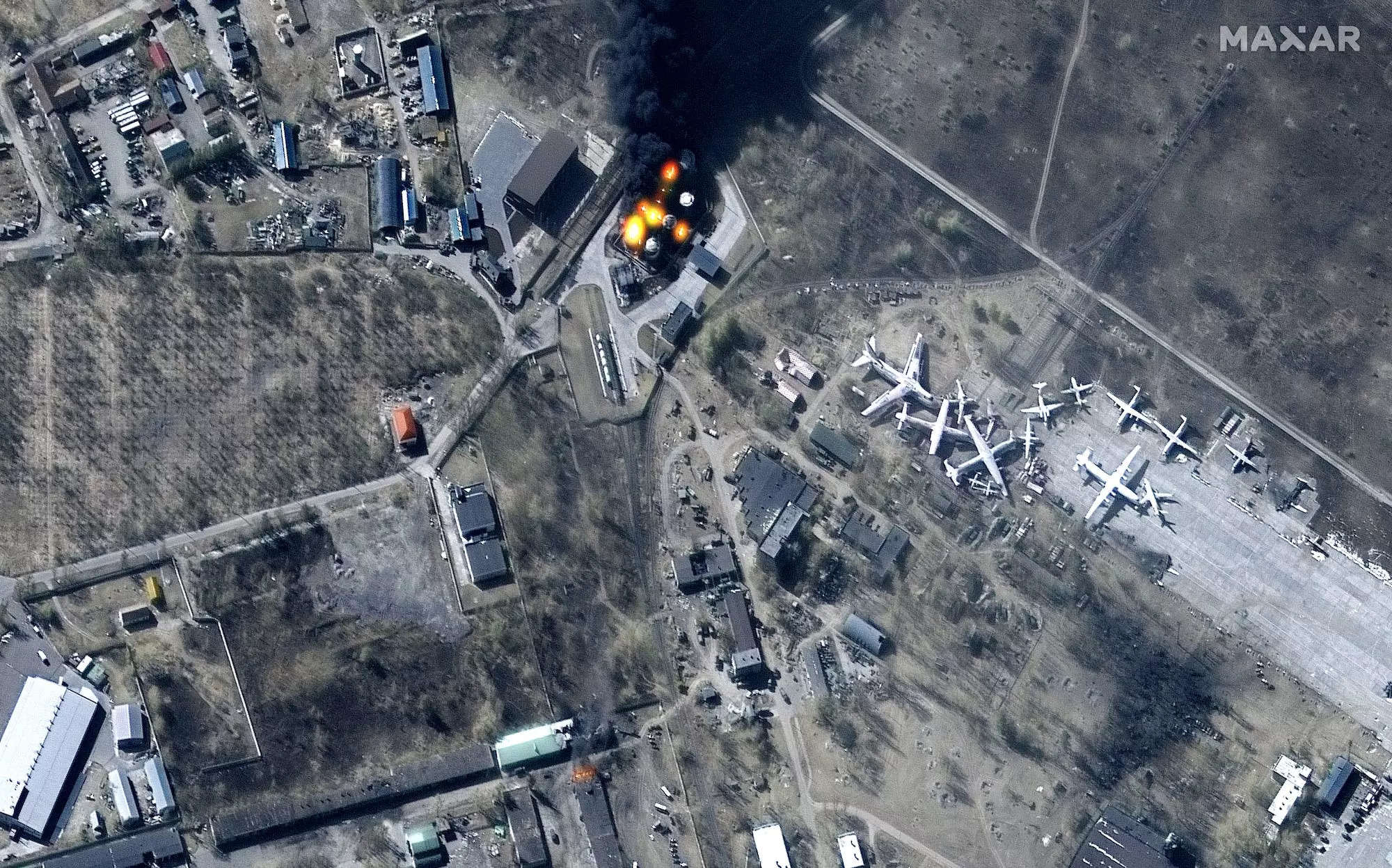 Damaged buildings and fuel tanks on fire at Antonov Airport in Hostomel, Ukraine, March 11, 2022