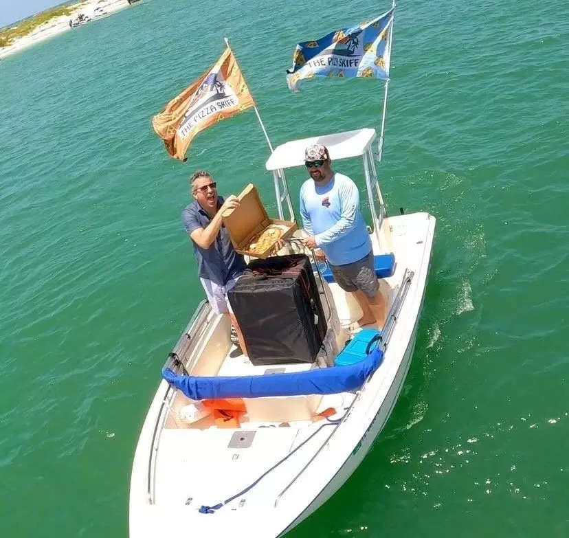 A Florida restaurant owner bought a boat to launch his side hustle selling $20 pizzas to swimmers and sunbathers in Tampa Bay