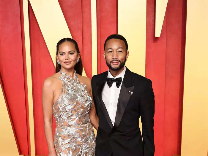 Chrissy Teigen's dress was covered in cutouts, while John Legend rocked a retro suit.